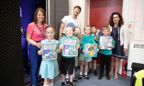 Year 2 children with books