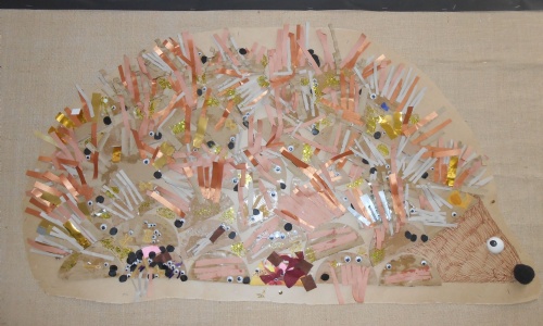 Hedgehog shaped collage with straws and googly eyes
